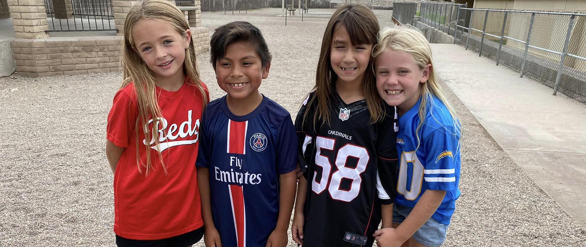 Students wearing sports jerseys for Spirit Day