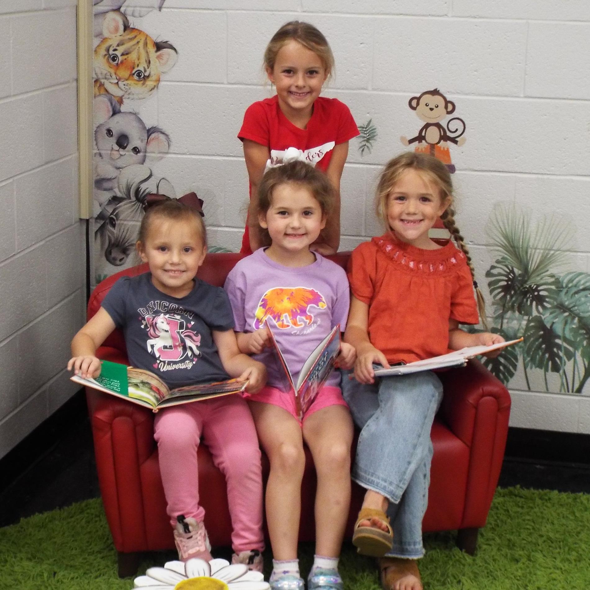 Happy students reading in library