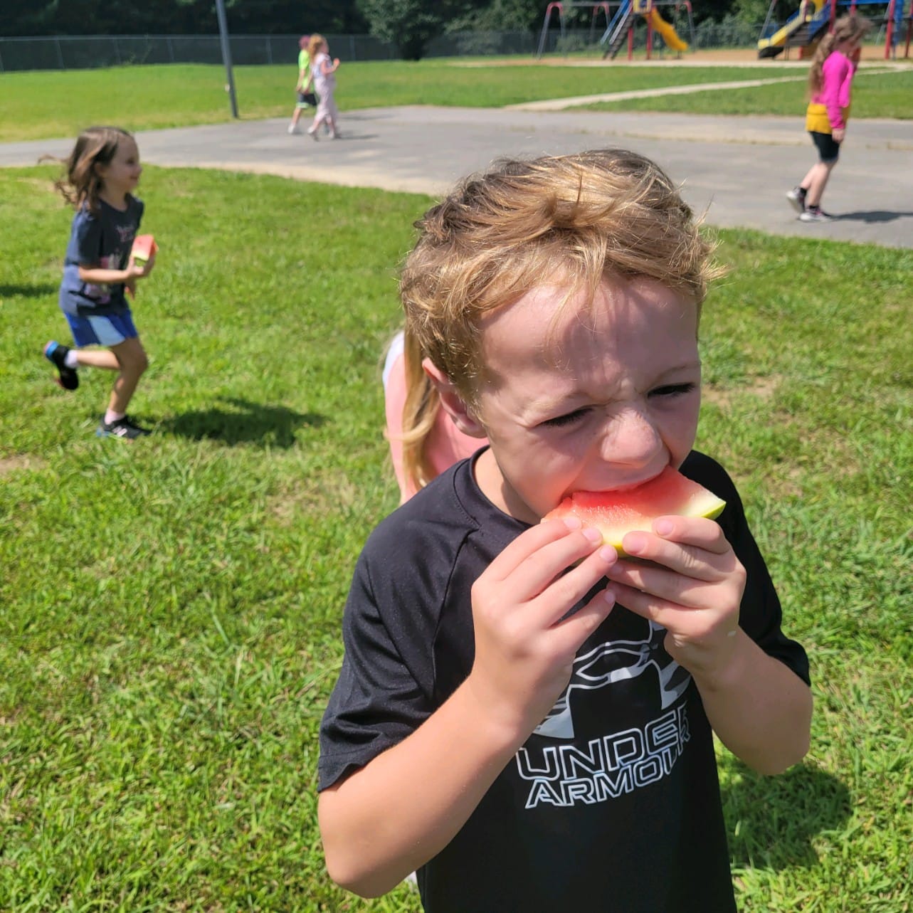 student eating watermelon