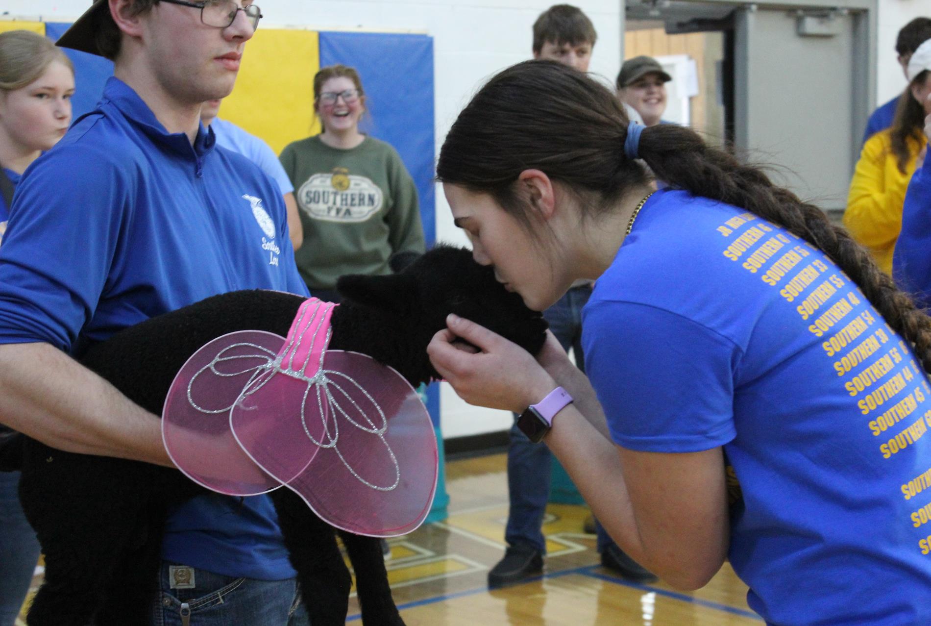 Katie Kellogg and a lamb