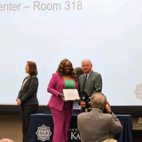 Ms. Evans accepting her award
