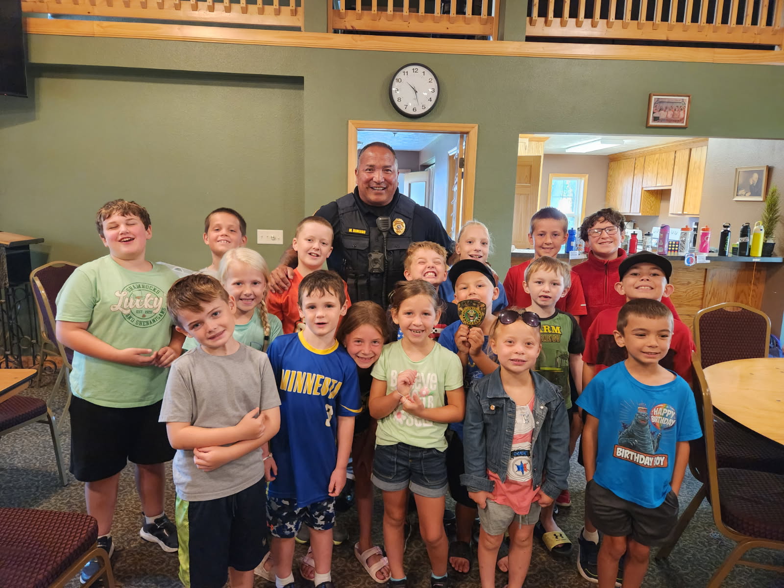 Children Smiling by local police officer