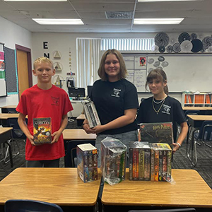 The Bartlett Family donated books to Mrs. Bonsang's classroom at Thunderbolt Middle School.