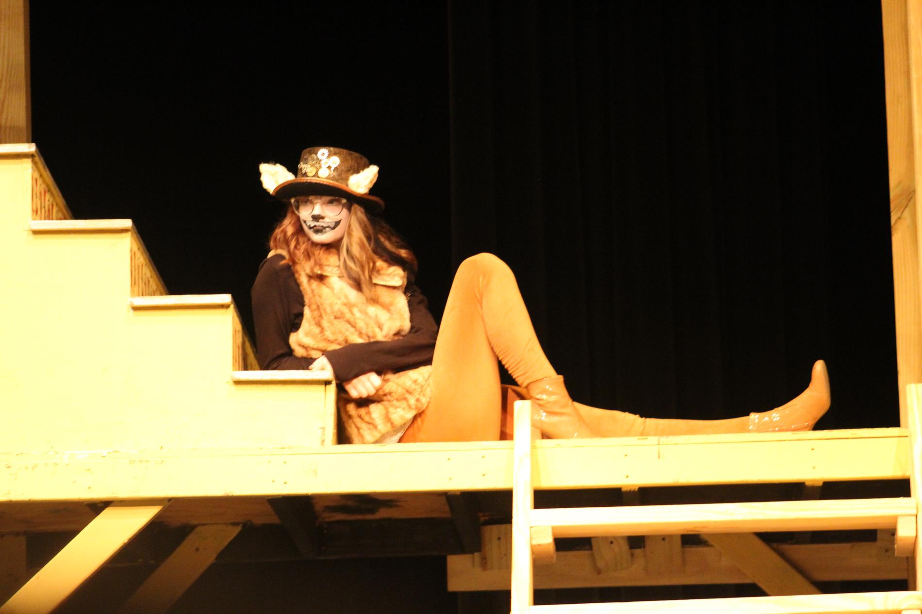 student playing the Chesire cat in Alice in Wonderland