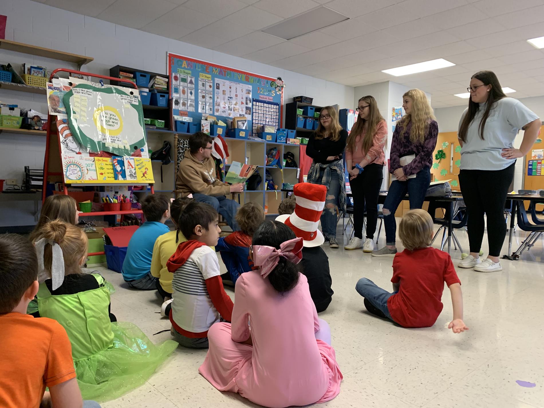 high school students read to younger students
