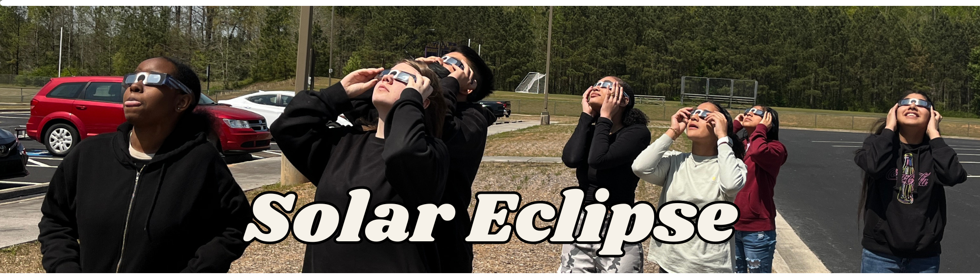 Students looking at the solar eclipse
