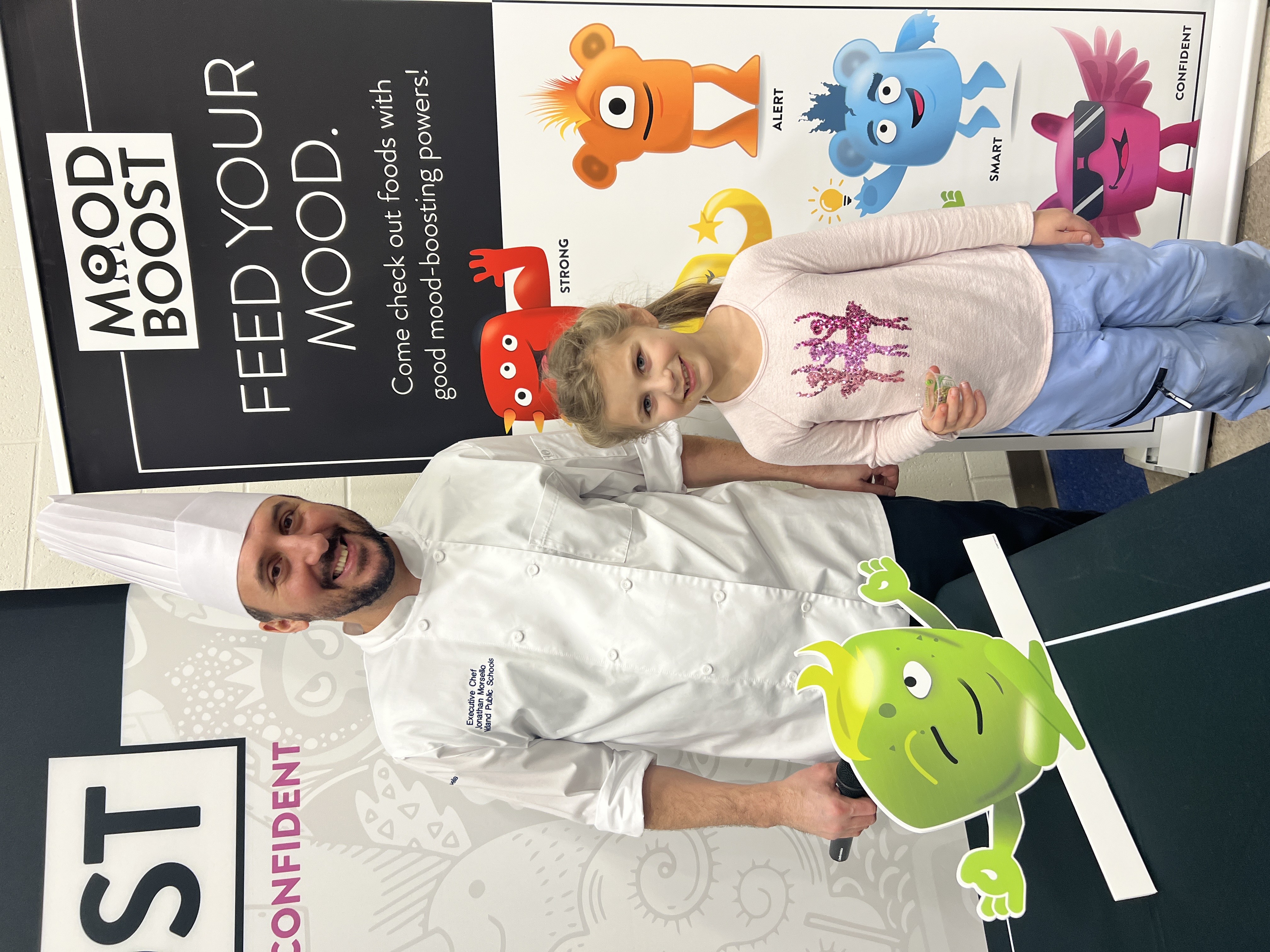 Student posing with  chef
