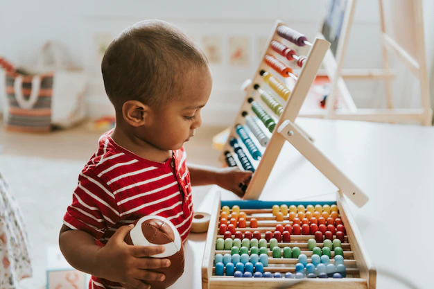 boy playing with abacus