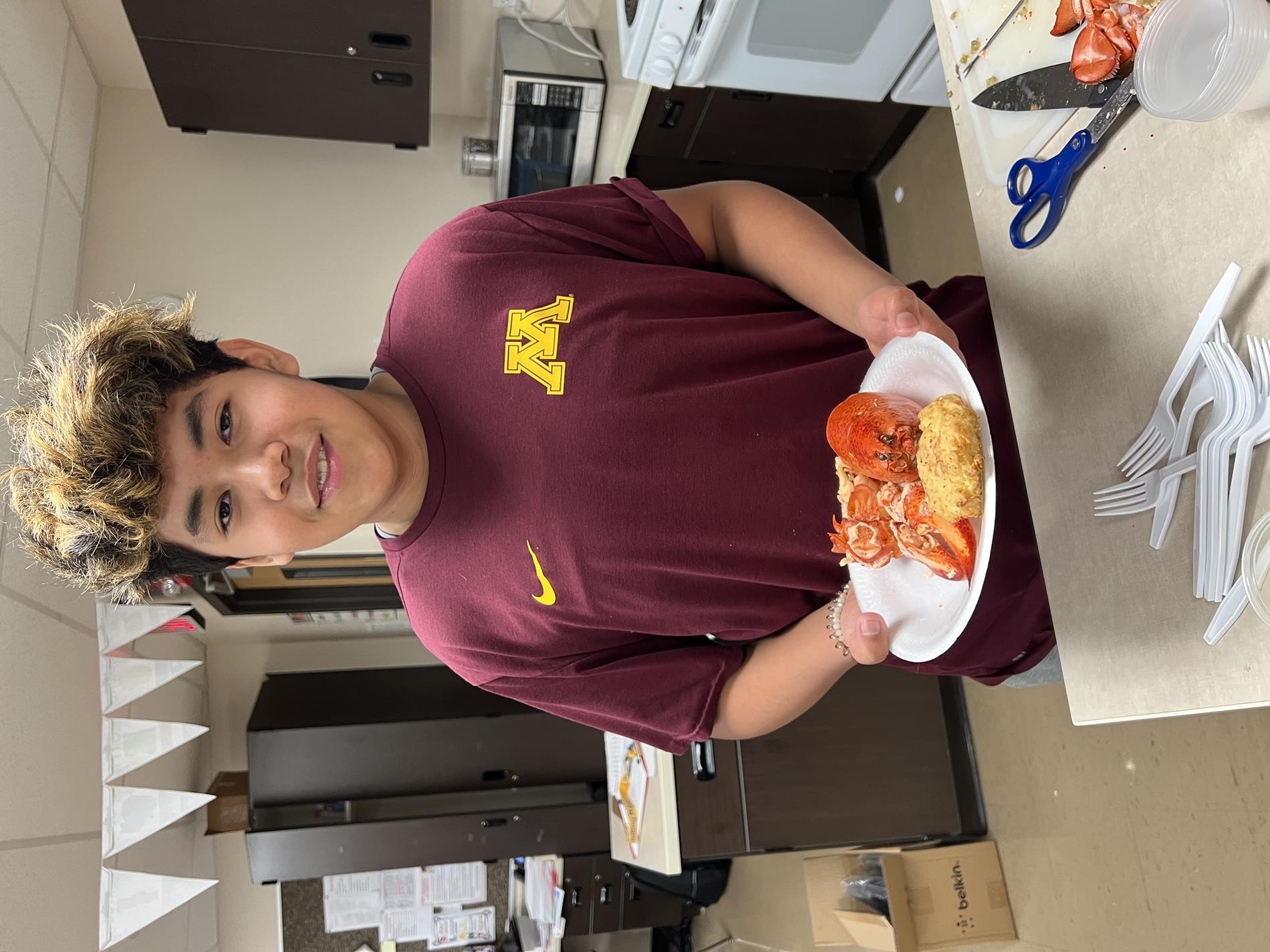 A student with a complete lobster meal. 