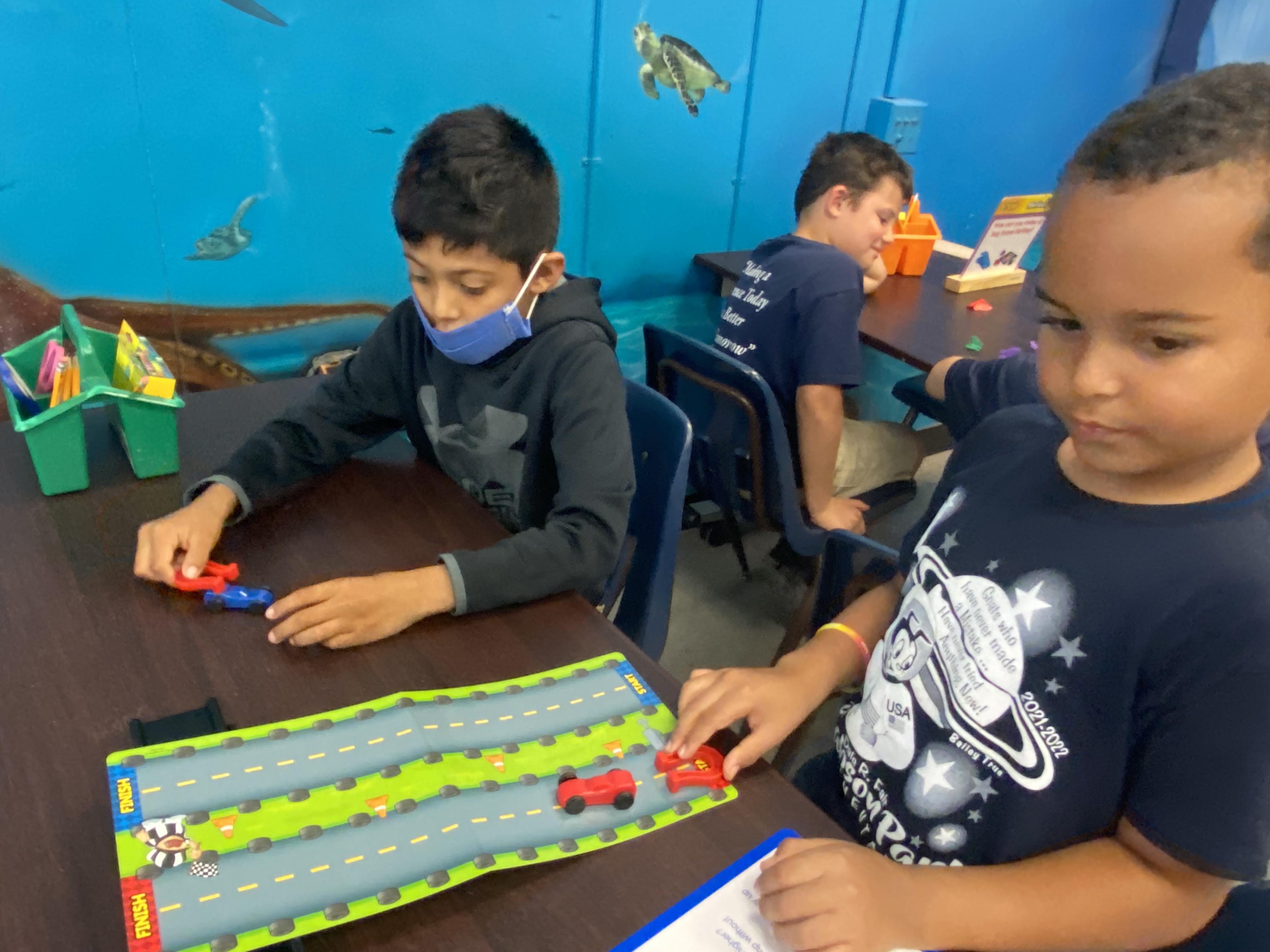 1st Grade students exploring magnets.