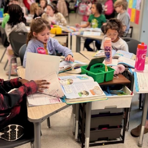 3rd grade students working