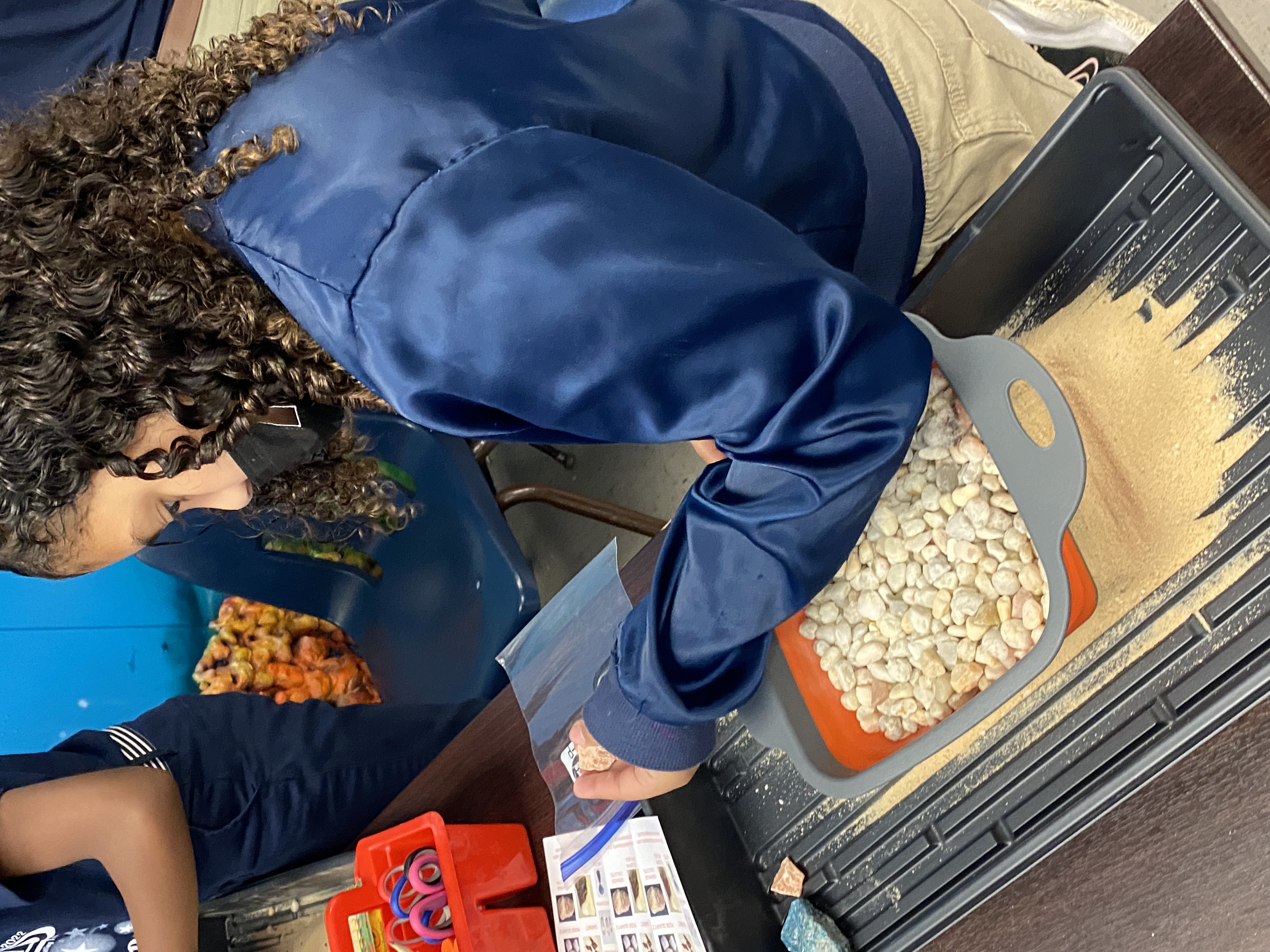 4th grade students mining for rocks and minerals.