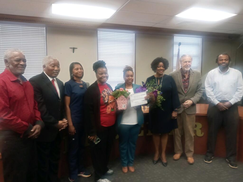 Dr. Cain with Dr. Robinson, Principal, Dr. McKendrick,  Interim Superintendent,  and Mrs. Soles Scott, Board President, and other Board Members
