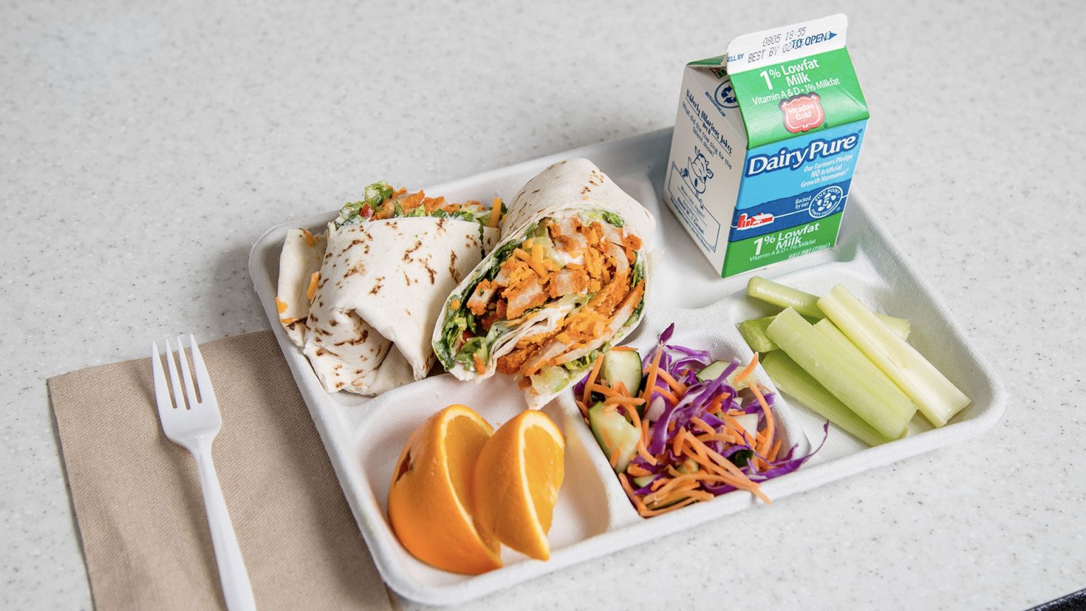 cafeteria tray with colorful food items