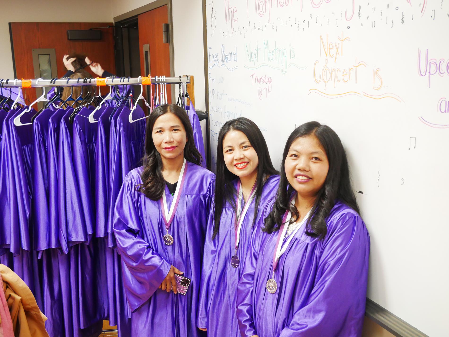 Girls smile at the Camera before walking the stage at graduation 2026. 