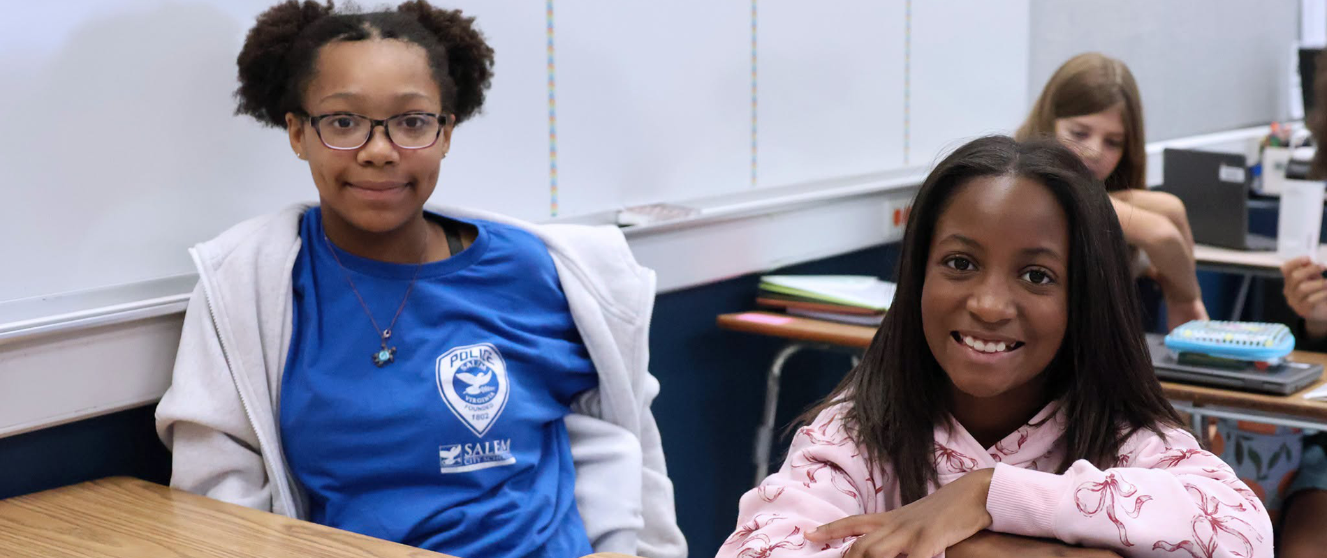 Students sitting in desks in class