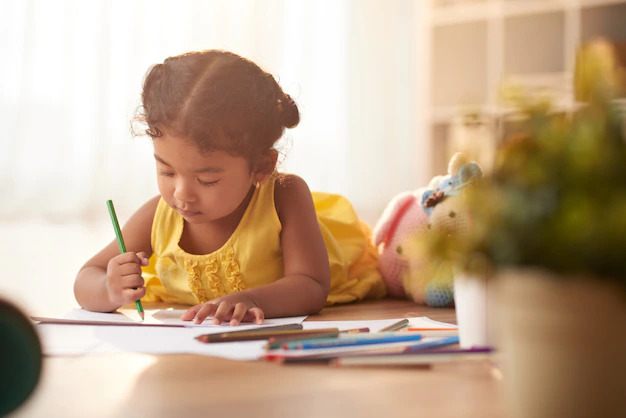 Little girl writing