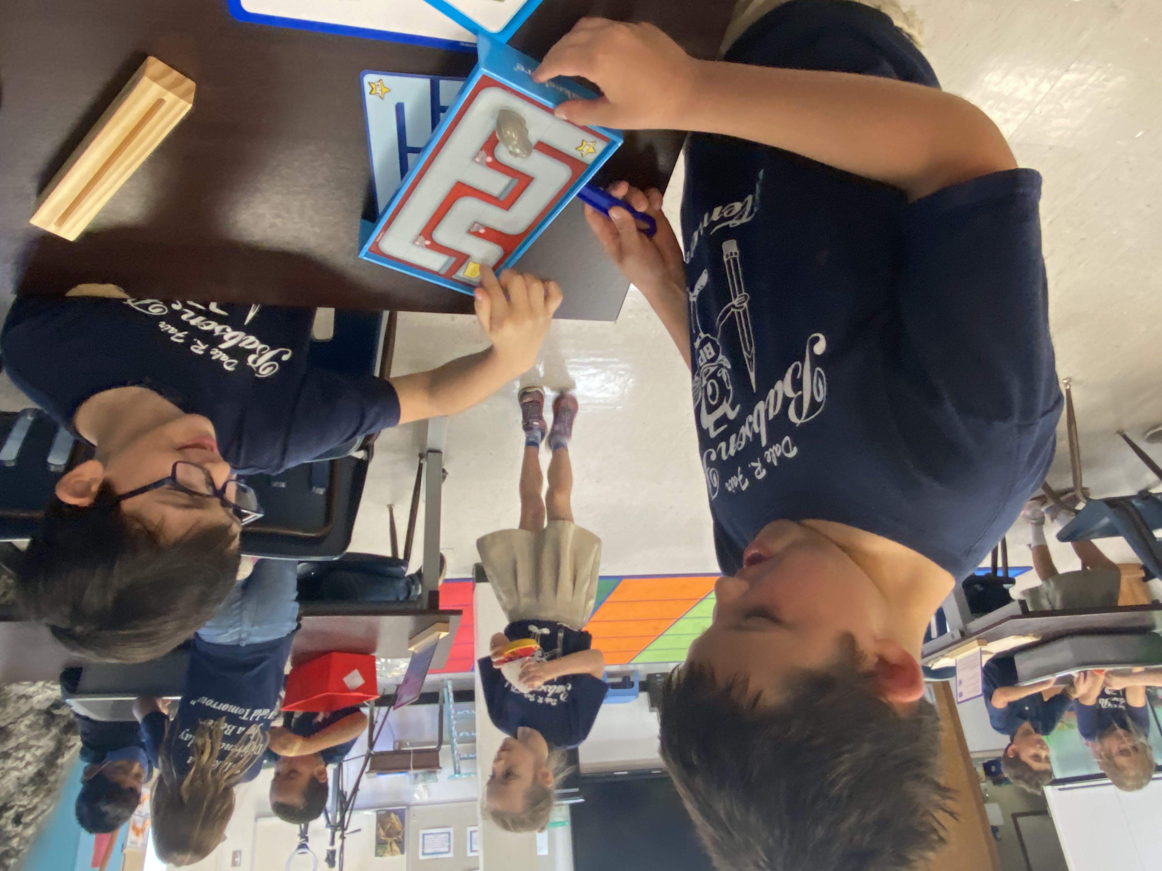 1st Grade students exploring magnets.