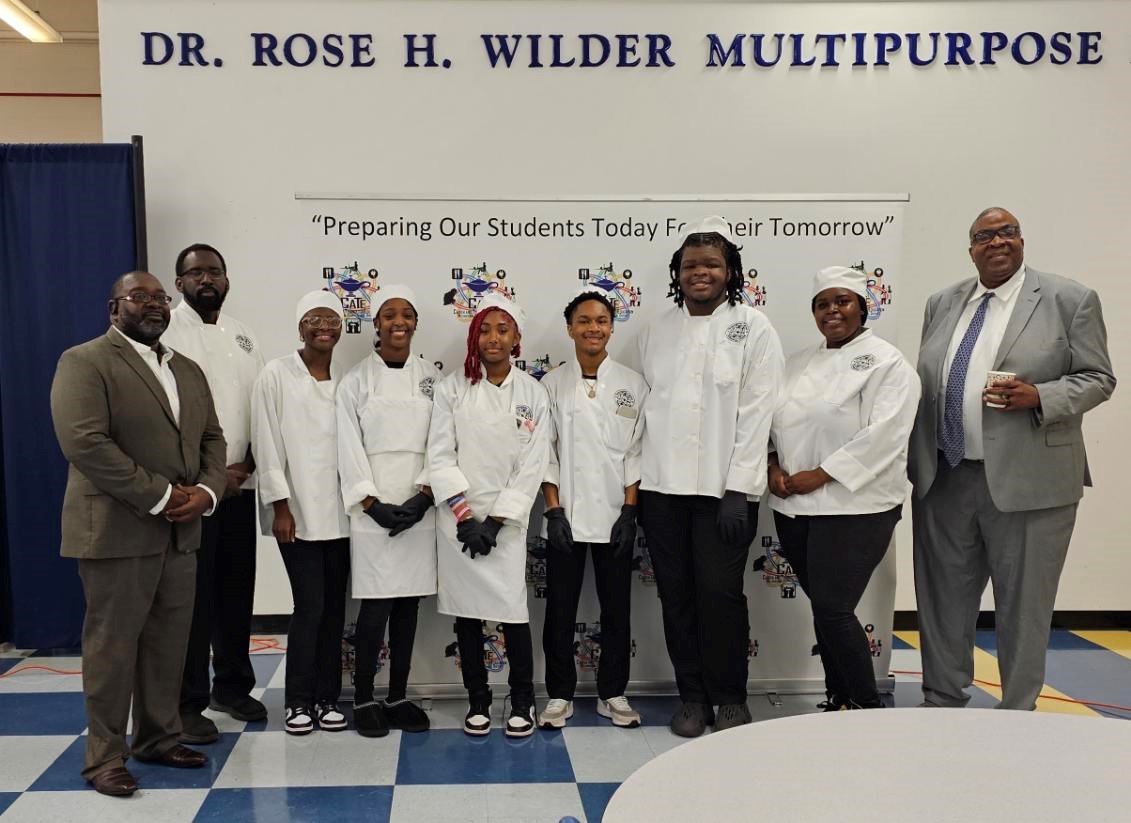 culinary arts students pictured with superintendent and principal