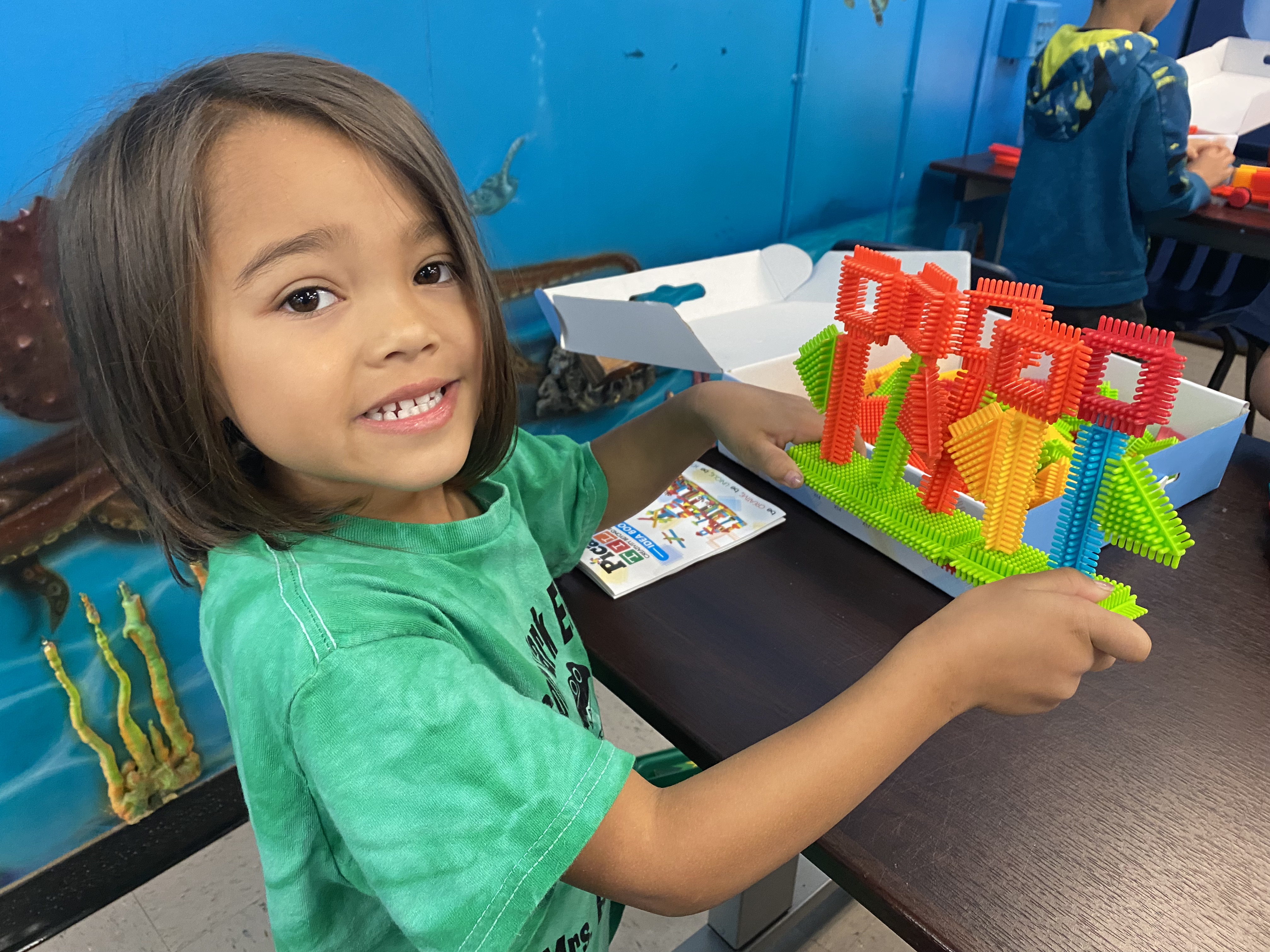 Kindergarten students exploring how to be an engineer with Bristle toys.
