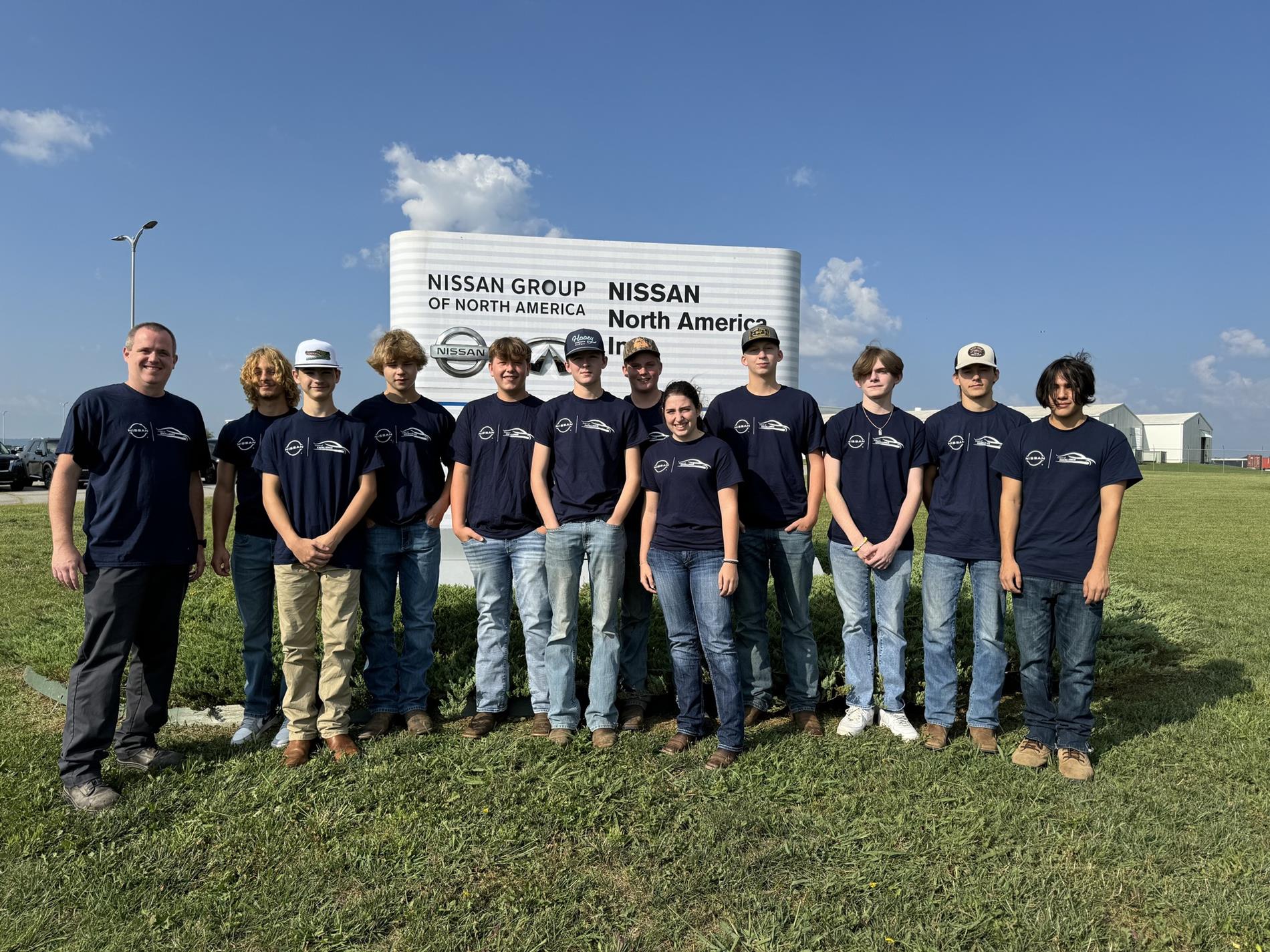 Students in front of Nissan