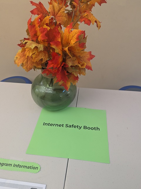 Image of flowers in vase on interenet safety resources booth table