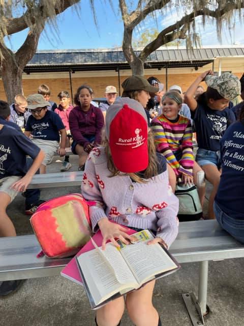 Gnats wearing hats to celebrate Hats Off To Reading on our first day of Literacy Week.