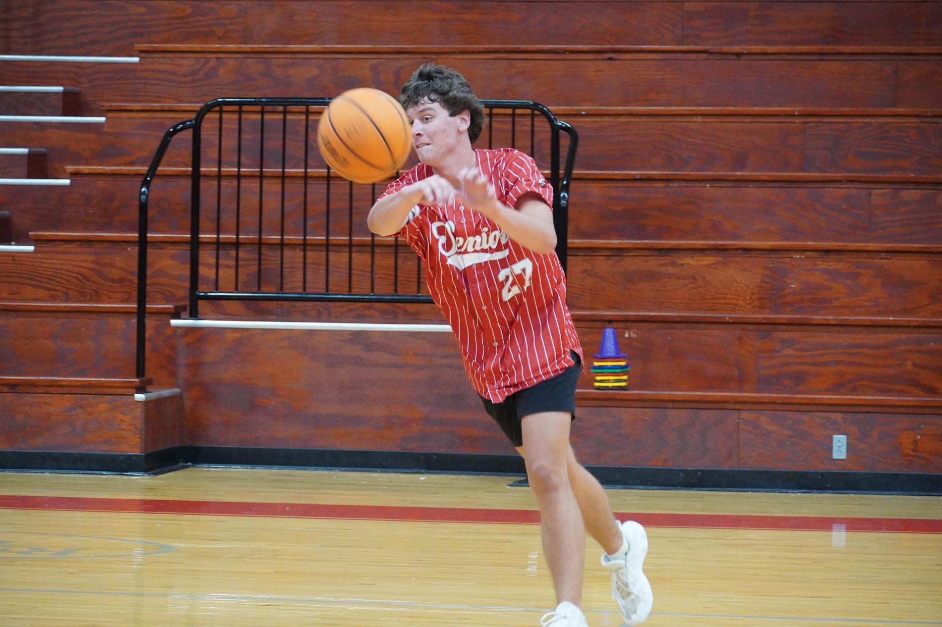 Senior Playing Basketball