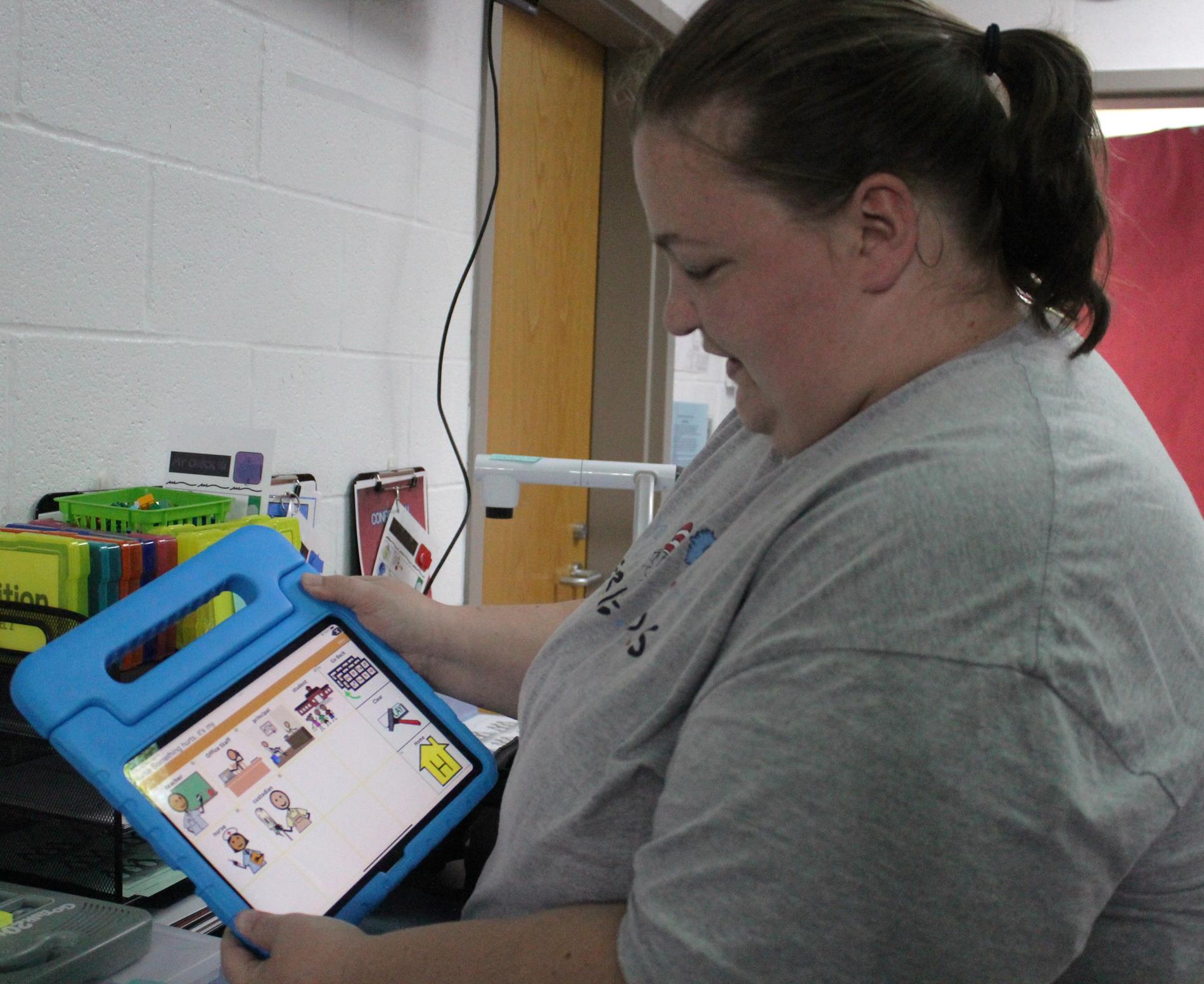 Ashley Farnsworth demonstrates an AAC unit