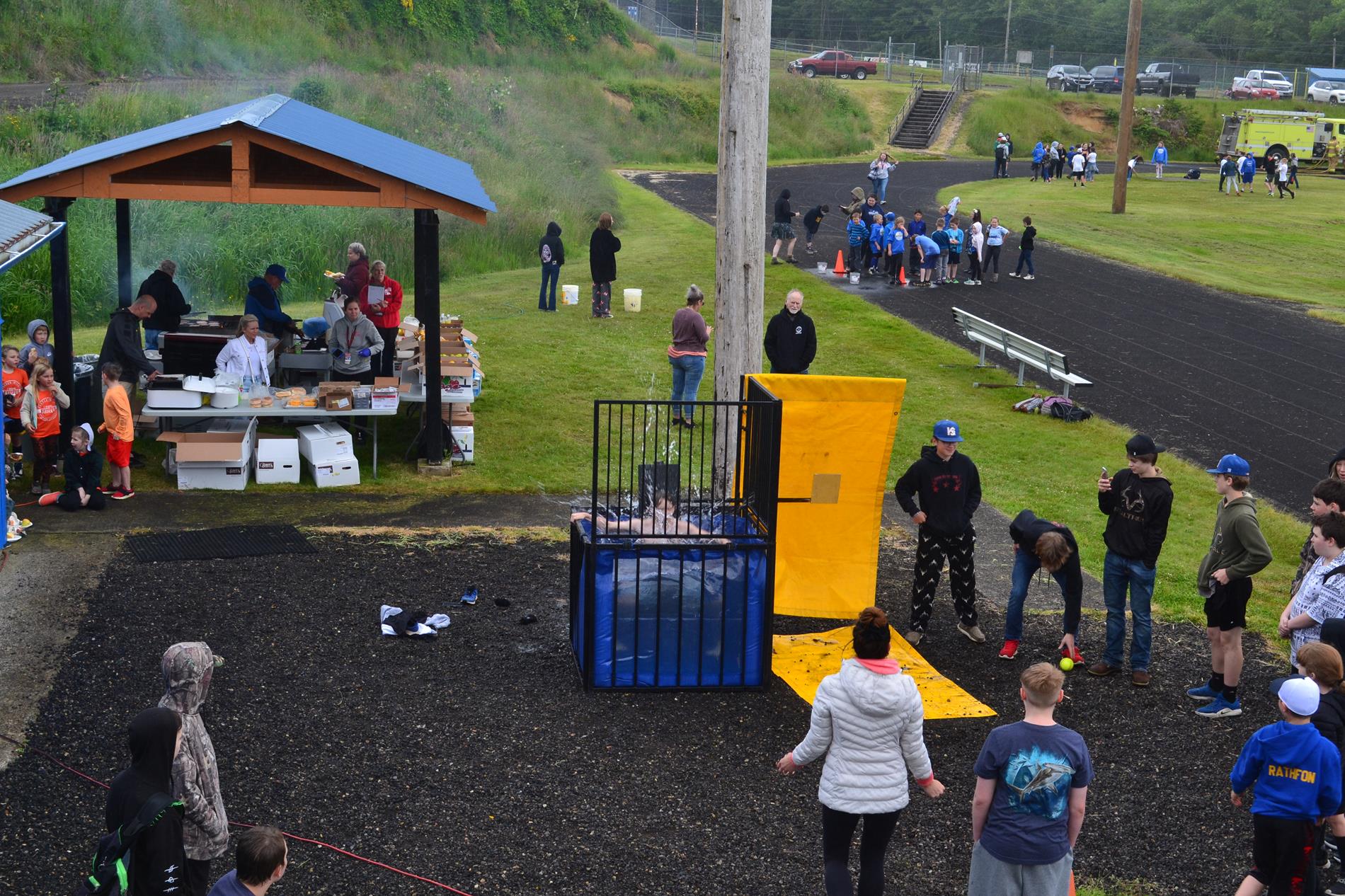 Students winning at the dunk tank. Splash! 