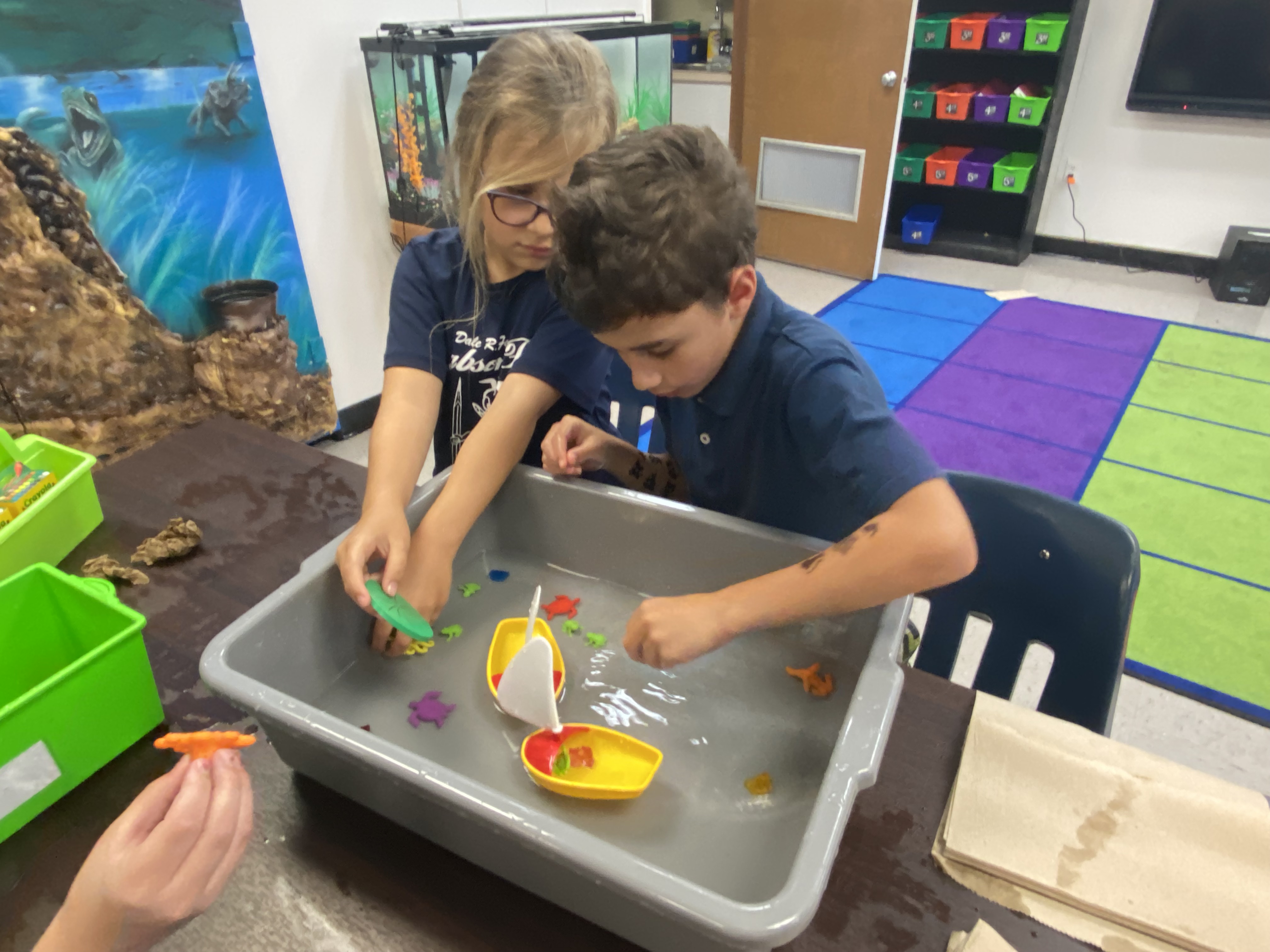 1st Grade students exploring if things sink or float.