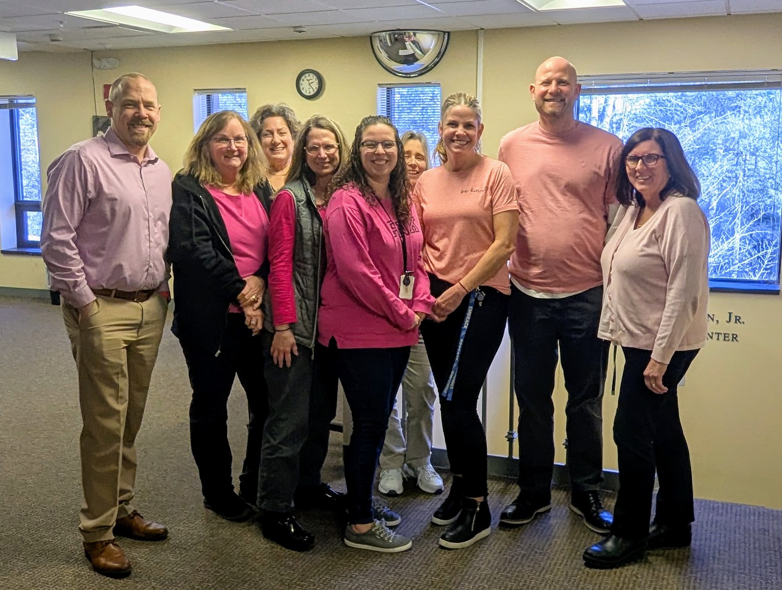 Picture of staff wearing pink shirts