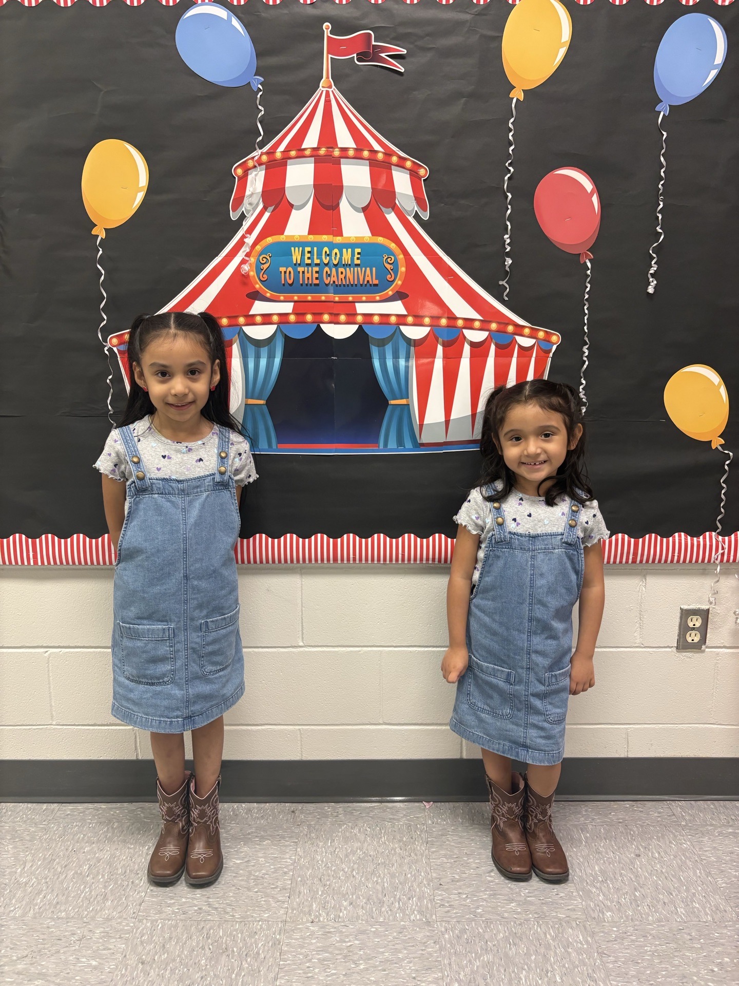 2 CBES first graders with dresses on.