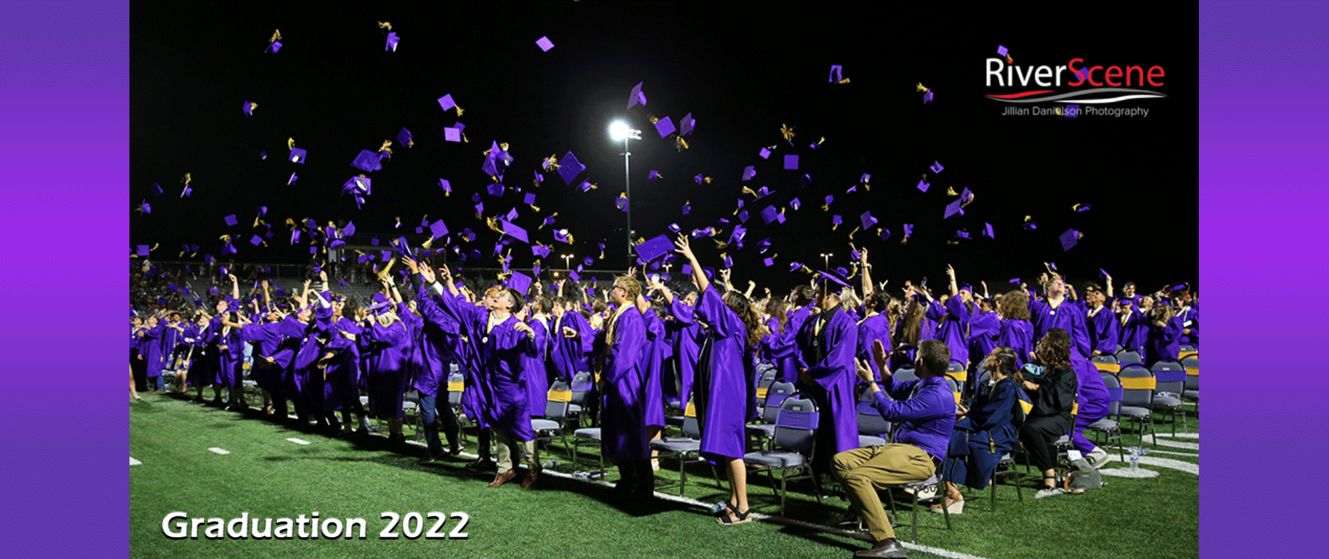 2022 Graduation class tossing caps into the air