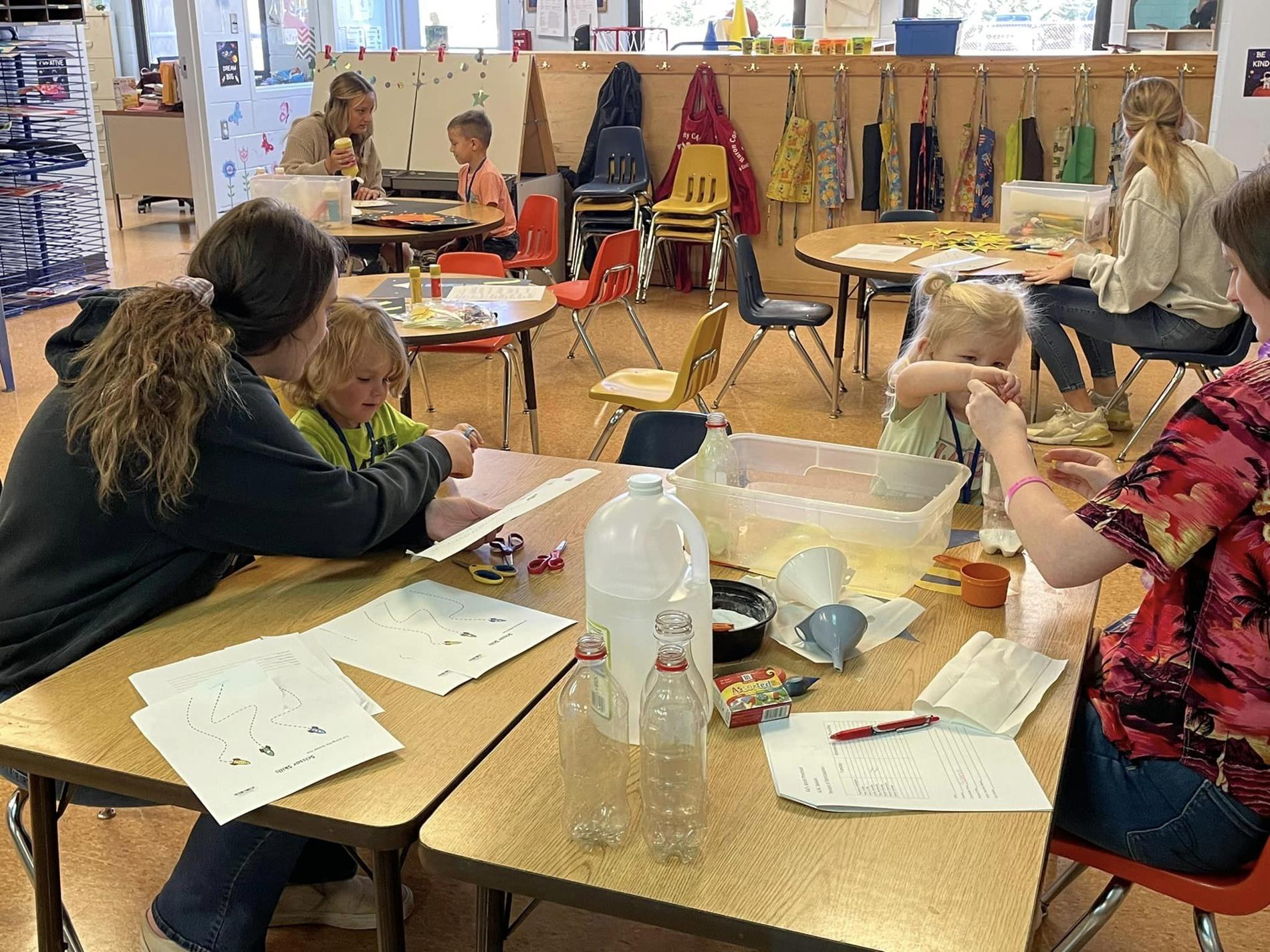 Students working hands-on in Kids' World Preschool.