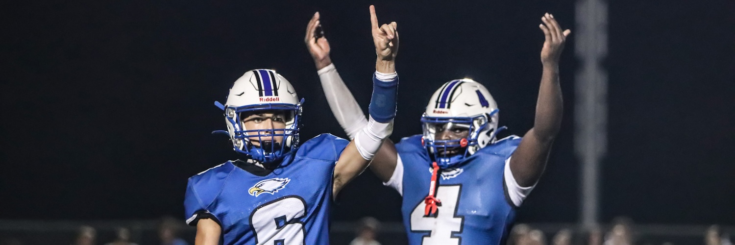 HS football players celebrate