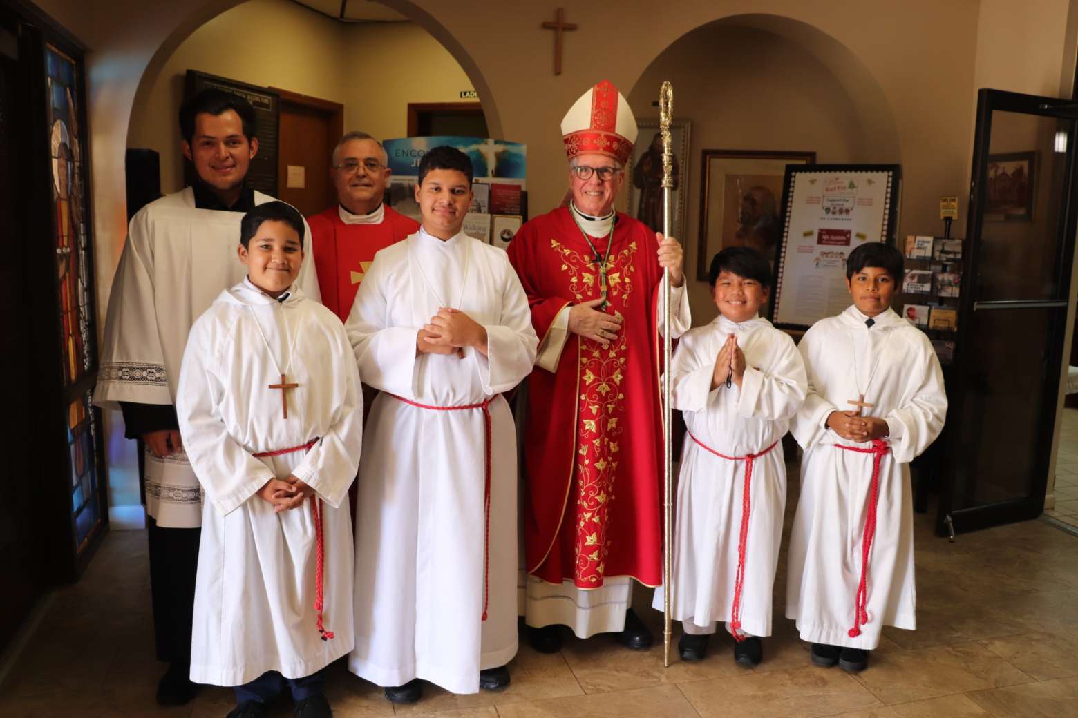 Bishop with Father and servers