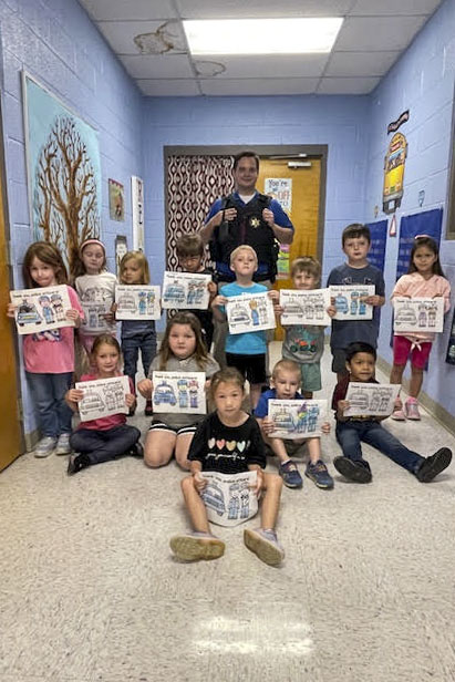 In a heartwarming display of community engagement, Officer Chris Hamer, School Resource Officer (SRO) from the Carroll County Sheriff's Department, recently visited a West Carroll Primary kindergarten class to discuss his role as a community helper.