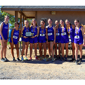 LHHS girls cross country team with their Meet Champions trophy