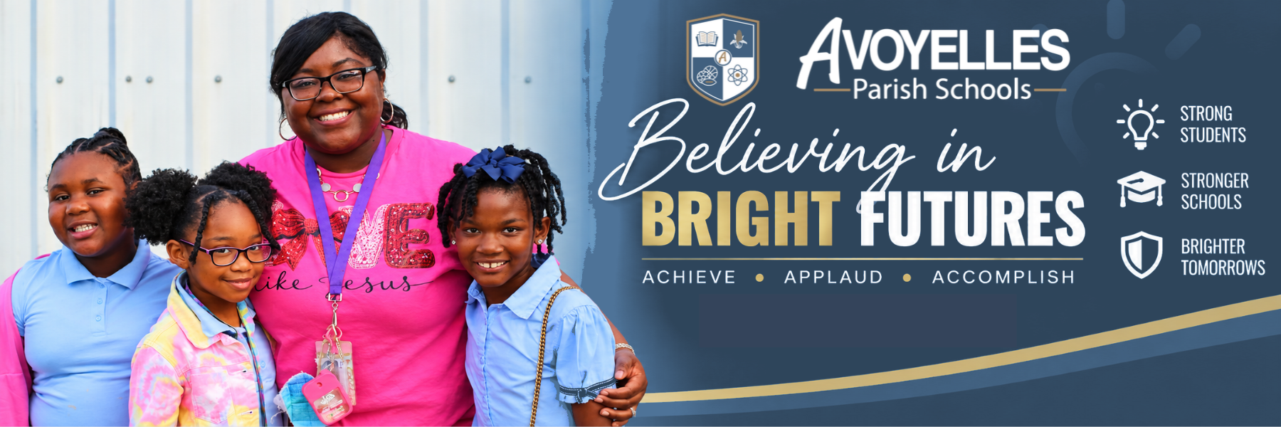 Avoyelles Parish Schools banner featuring an educator with three students alongside the message, “Believing in Bright Futures. Achieve, Applaud, Accomplish. Strong Students, Stronger Schools, Brighter Tomorrows,” with a Learn More About APS button.