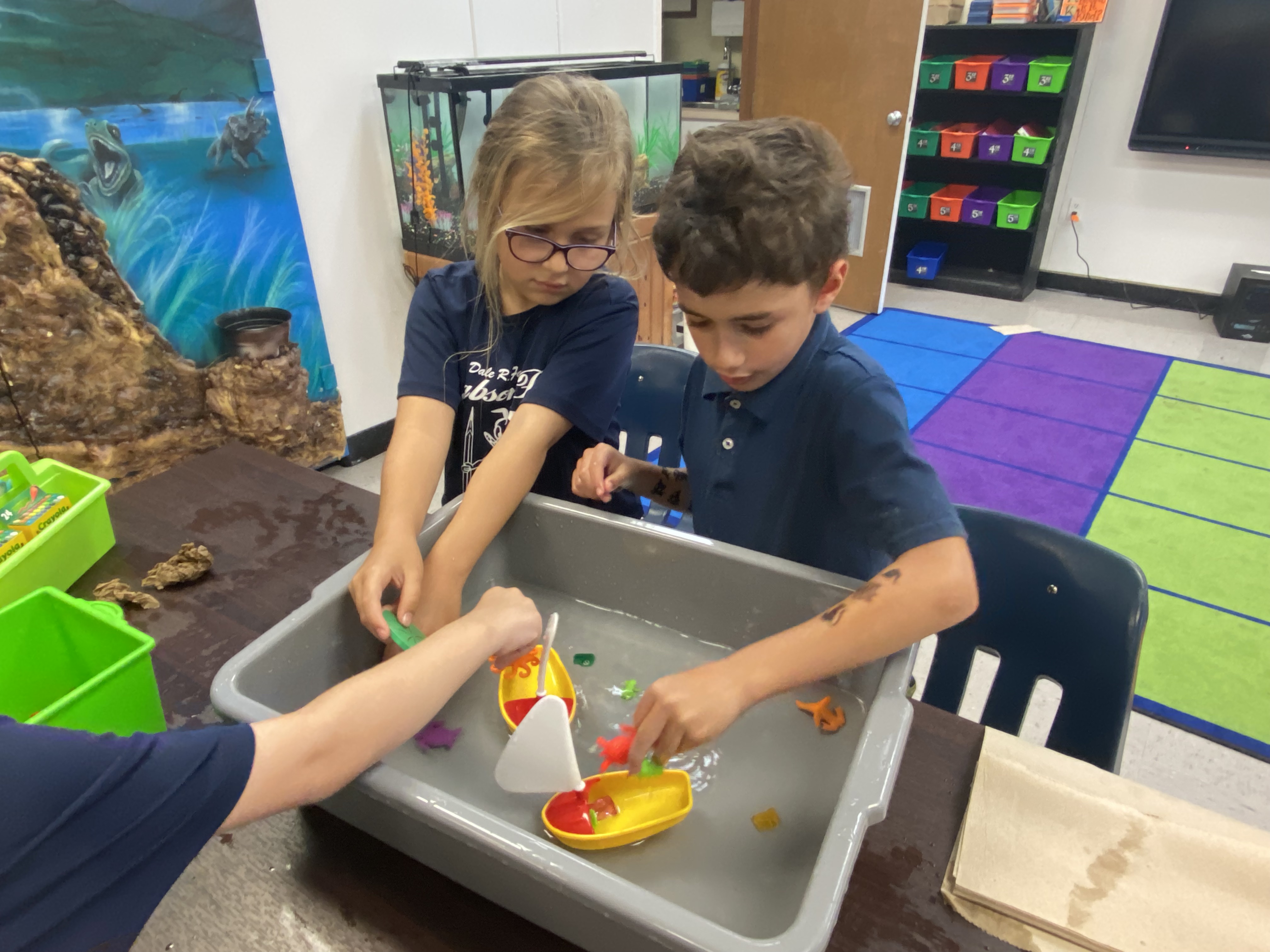 1st Grade students exploring if things sink or float.
