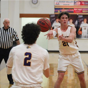 LHHS Boys basketball player passing the ball