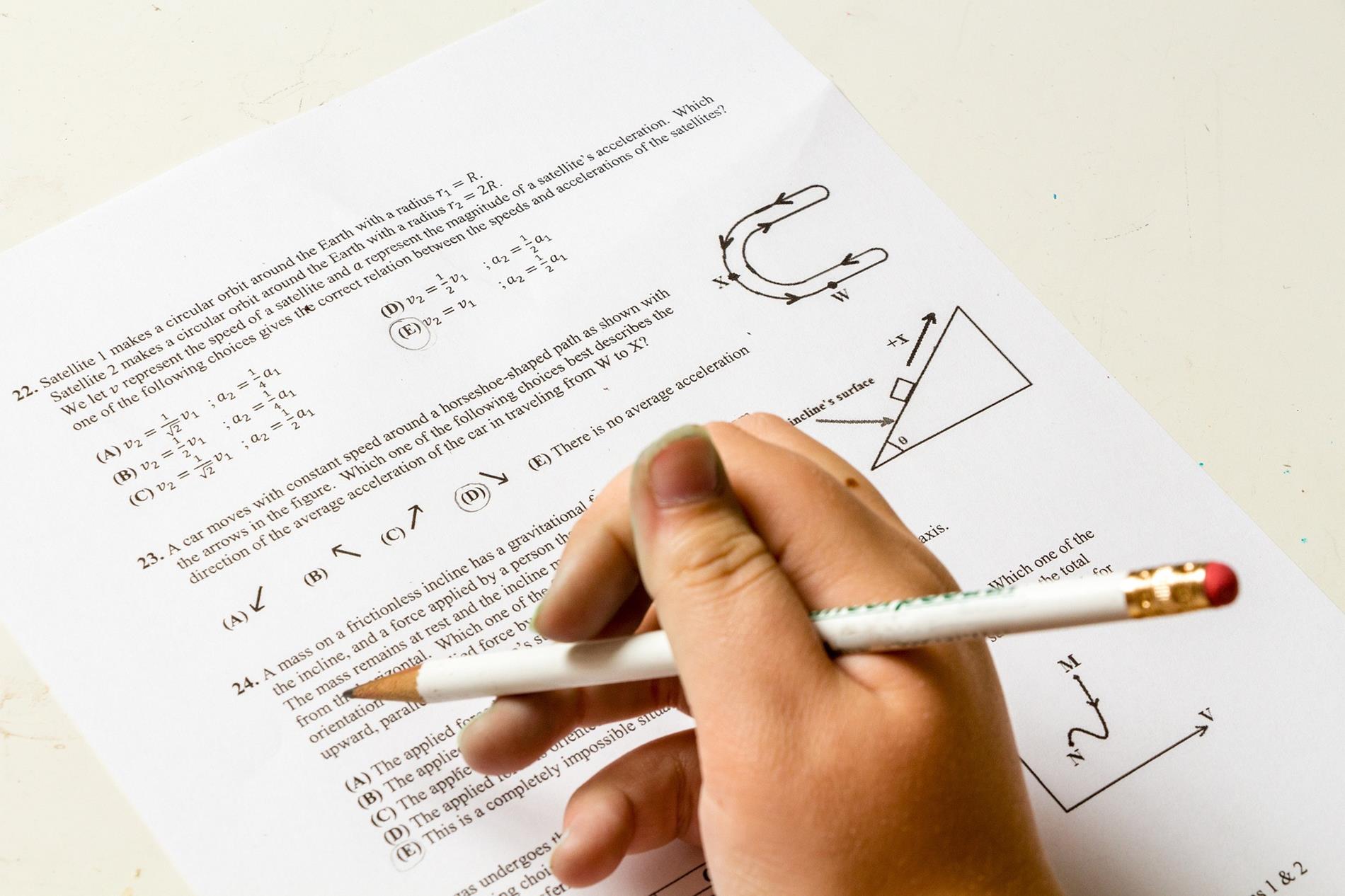 closeup of a student taking a paper and pencil test