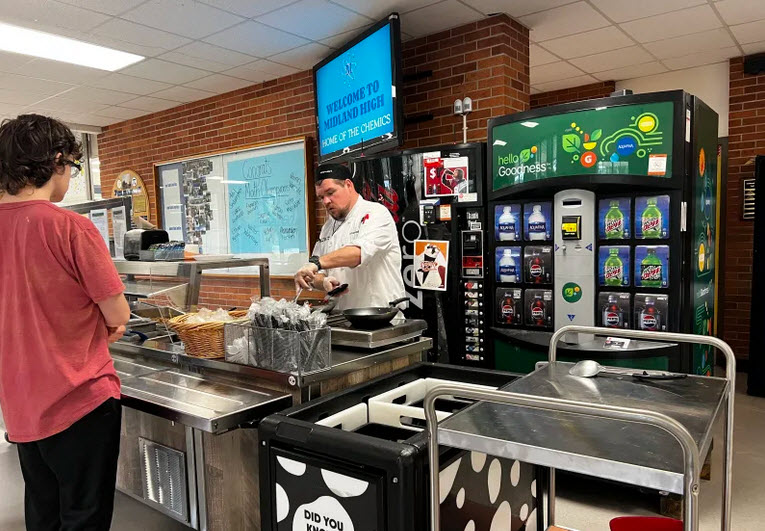 student in line being served