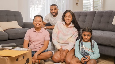 Family sitting together in a living room setting