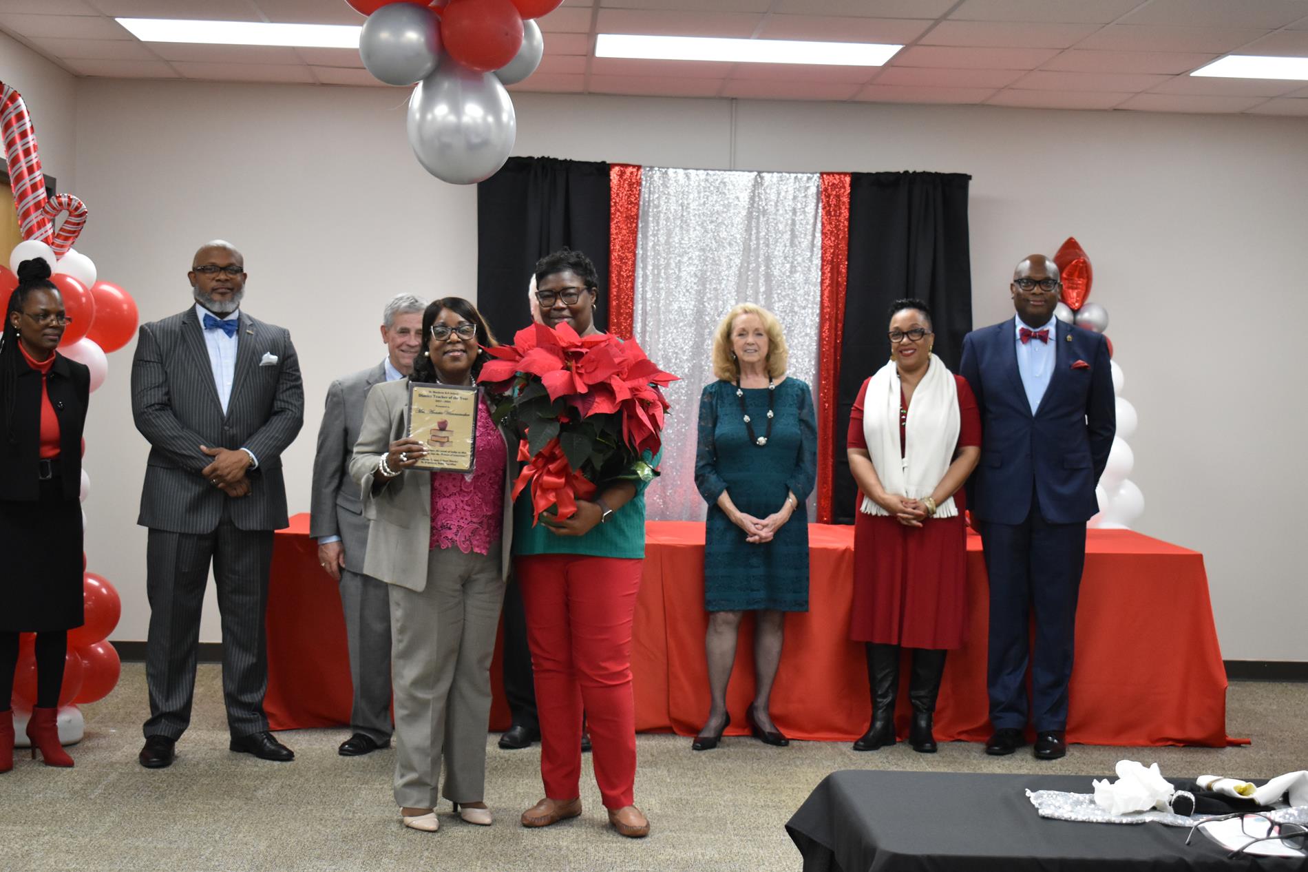 District Teacher of the Year being honored at the recent ceremony.