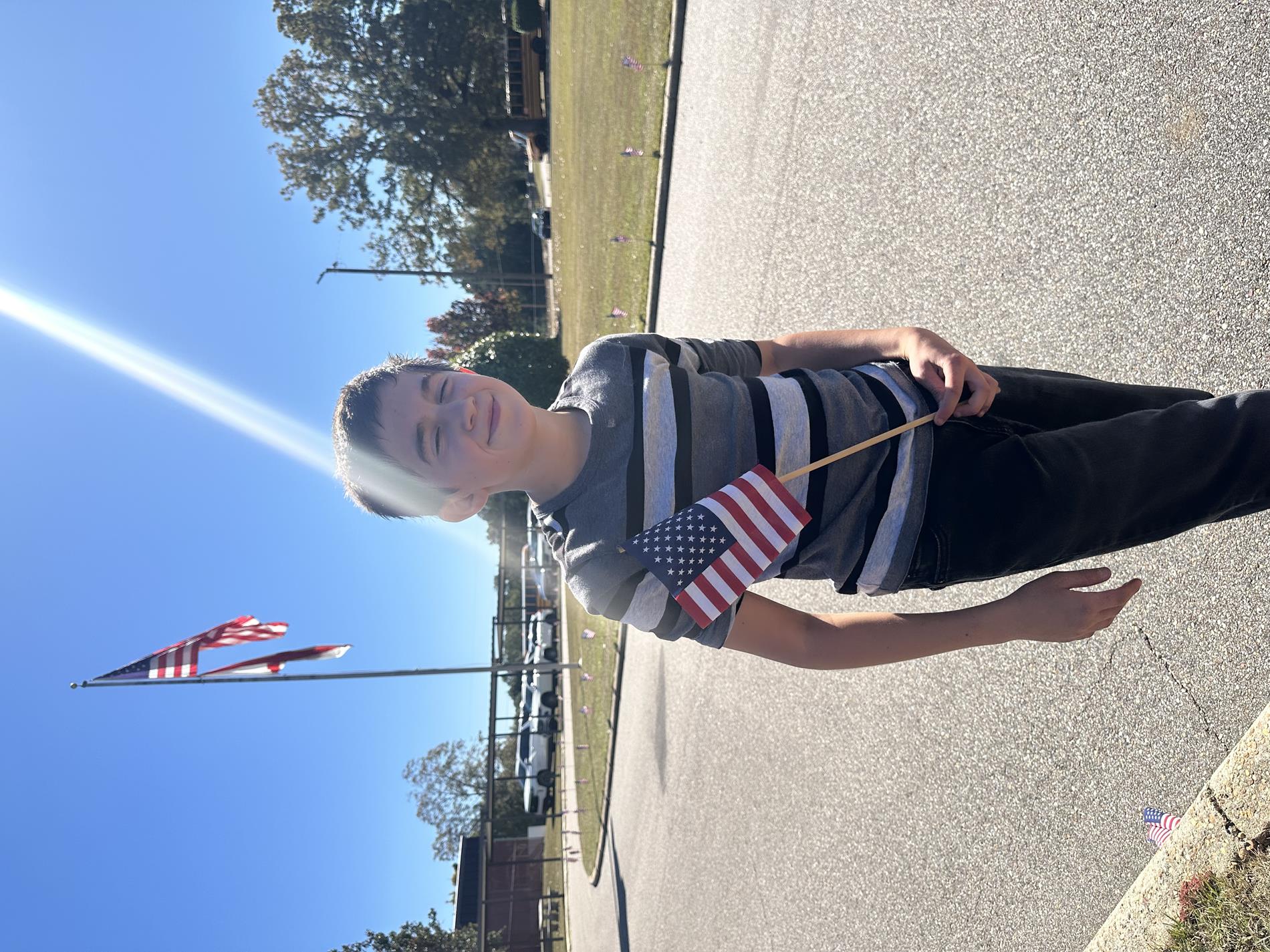Peer Helper members decorating our bus lane with flags in honor of Veterans Day.