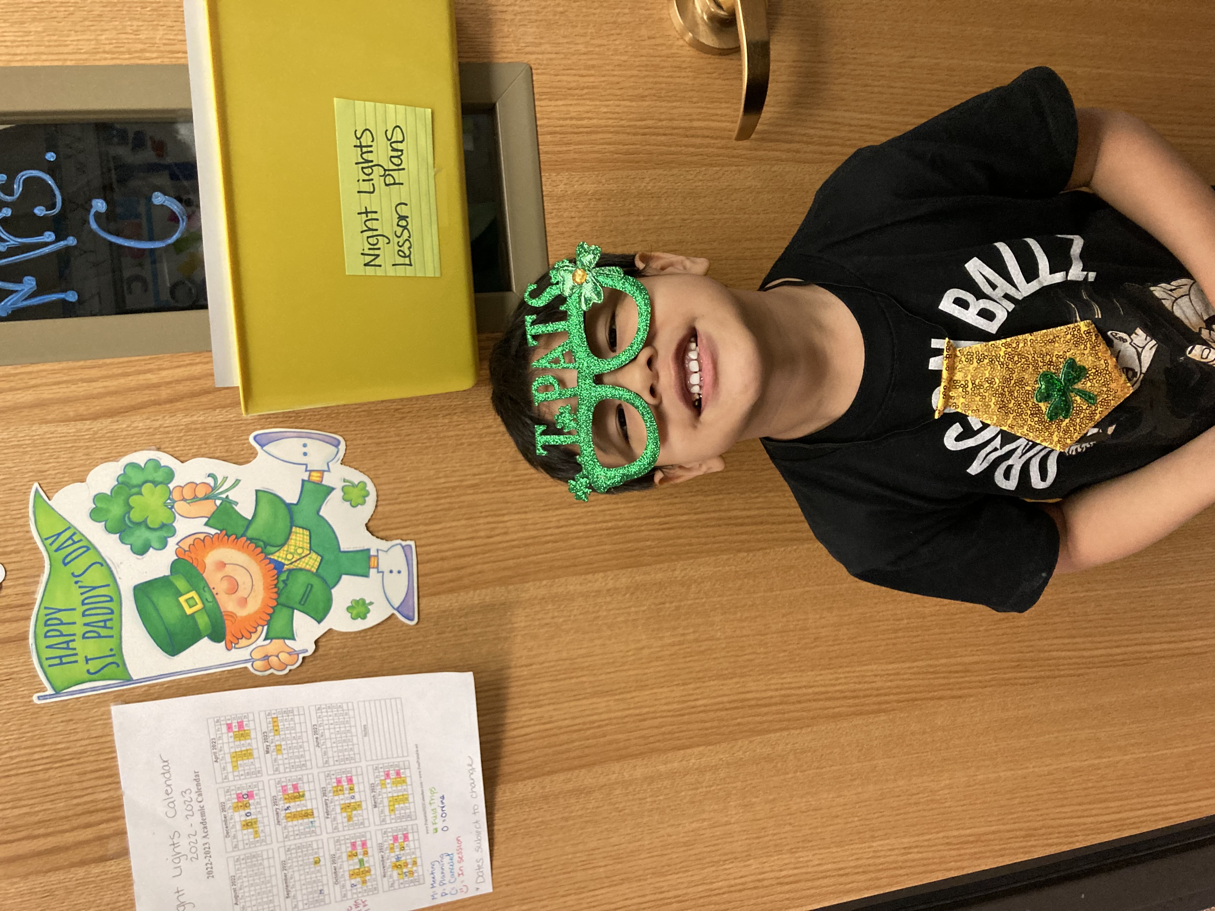 Elementary Student wearing St. Patrick's Day glasses