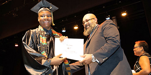 graduate getting diploma