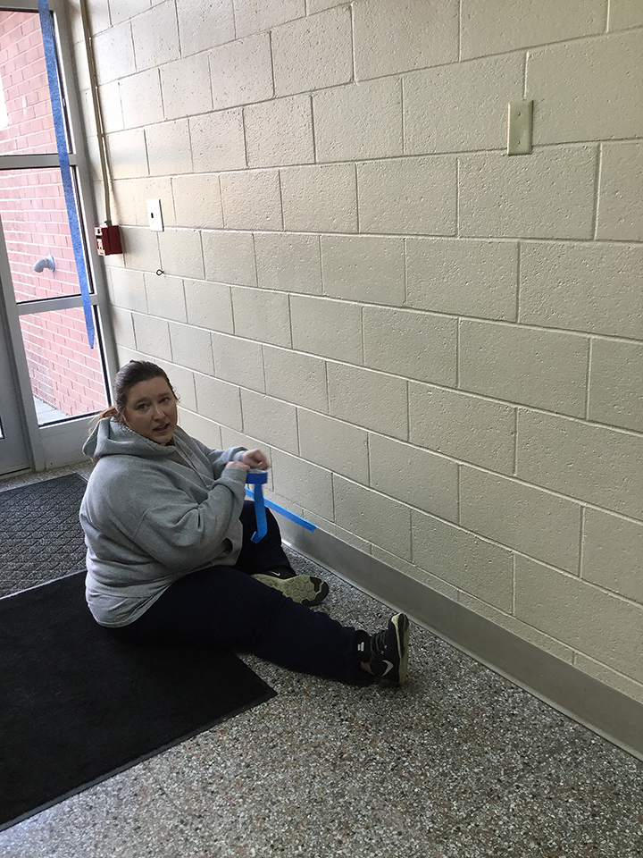 Students volunteering to help paint